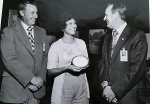 Dr. Estella Hernandez Gillette receiving the outstanding secretary award.  Cliff Charlesworth (left) and Chris Kraft, Credit: NASA